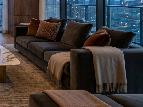 Lounge corner with velvet sofa and throws